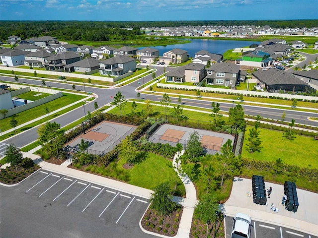 aerial view with a residential view and a water view