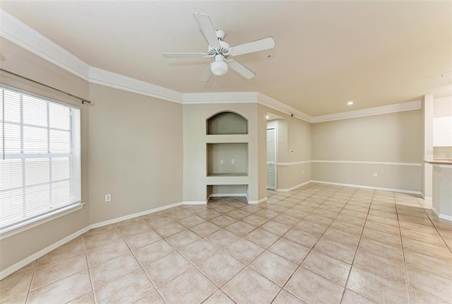 tiled spare room with ceiling fan and ornamental molding