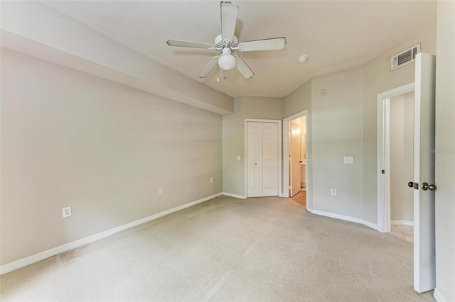 unfurnished bedroom with carpet flooring, ceiling fan, and a closet