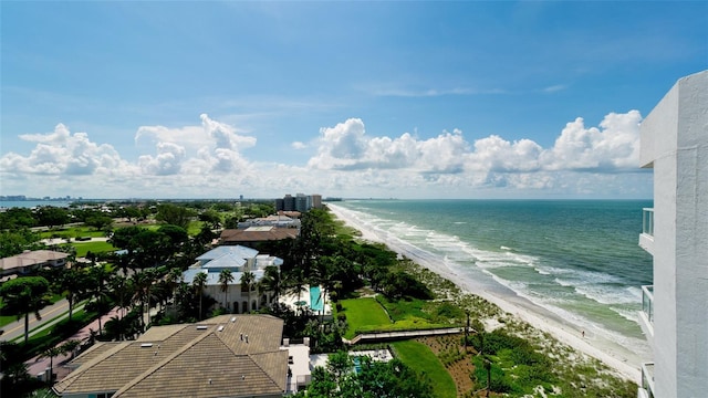 birds eye view of property with a view of the beach and a water view