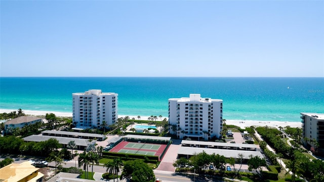 birds eye view of property featuring a water view and a view of the beach