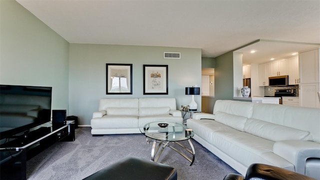 living area featuring recessed lighting, baseboards, visible vents, and carpet flooring