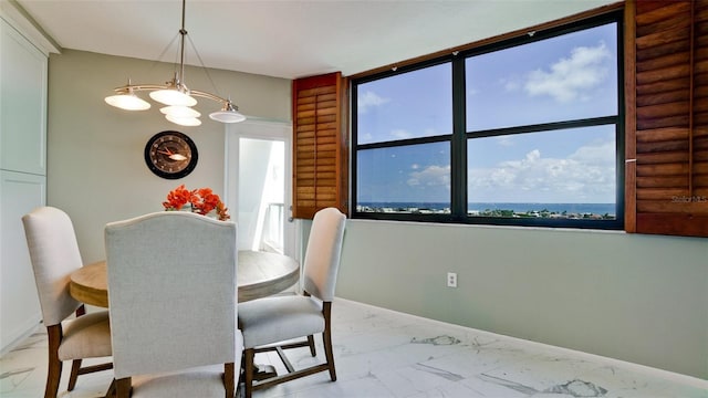 dining room with a wealth of natural light and light tile patterned floors