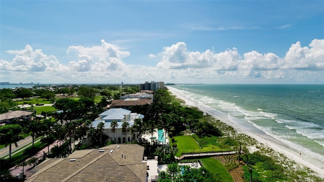 drone / aerial view featuring a view of the beach and a water view