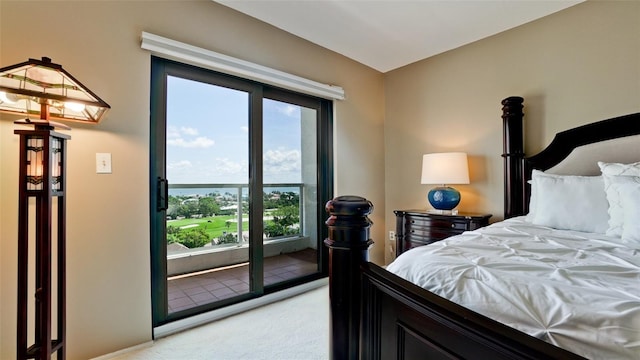 bedroom with light carpet and access to exterior