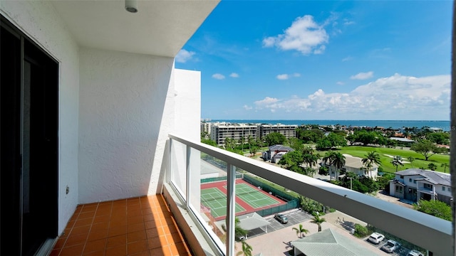 balcony featuring a water view