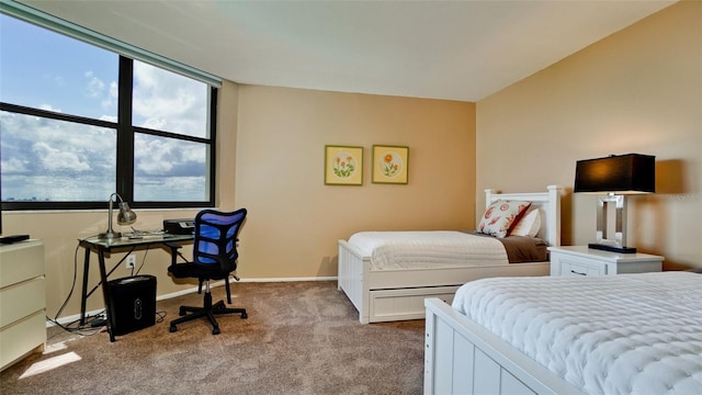 carpeted bedroom with baseboards