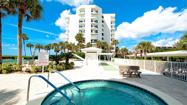 view of pool featuring a hot tub