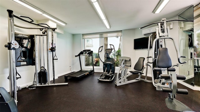 workout area with an AC wall unit