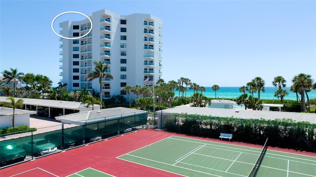 view of sport court featuring a water view