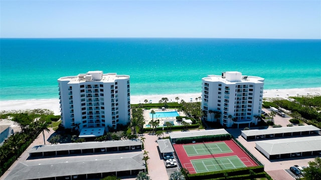 aerial view featuring a view of the beach and a water view