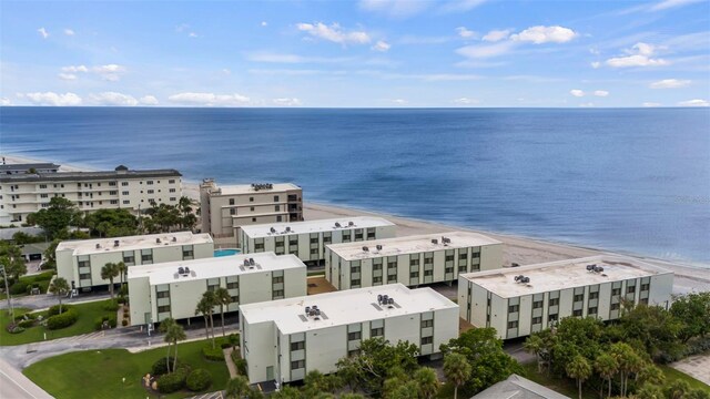 bird's eye view featuring a beach view and a water view