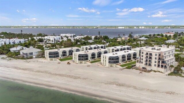 aerial view featuring a water view and a beach view