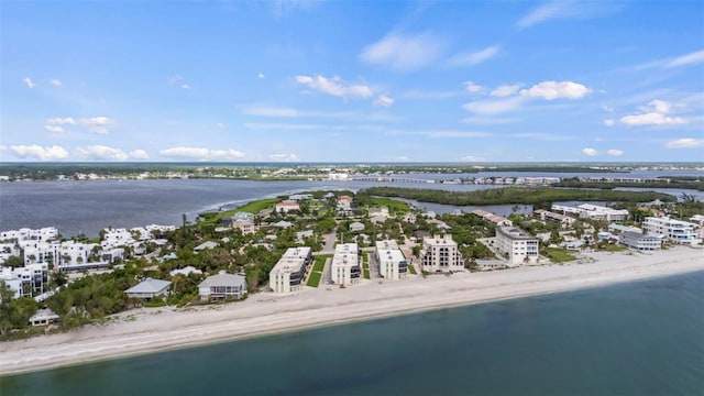 aerial view featuring a water view and a beach view