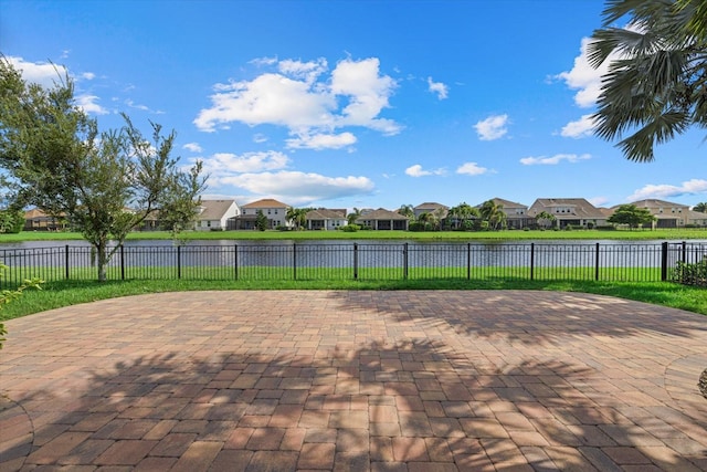 view of patio with a water view