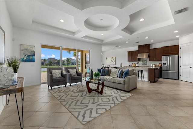 tiled living room with coffered ceiling