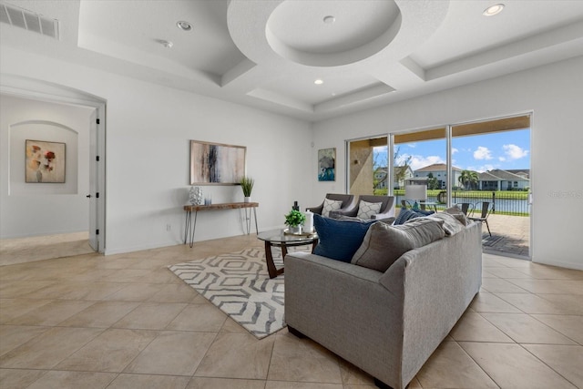 living room with beam ceiling, light tile patterned floors, and coffered ceiling