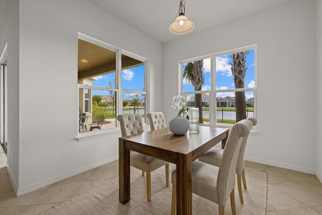 dining area featuring plenty of natural light and light tile patterned floors