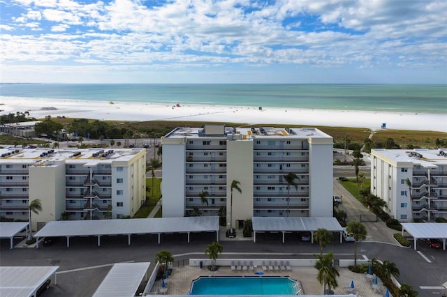 drone / aerial view with a beach view and a water view