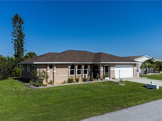 ranch-style home featuring a garage and a front yard