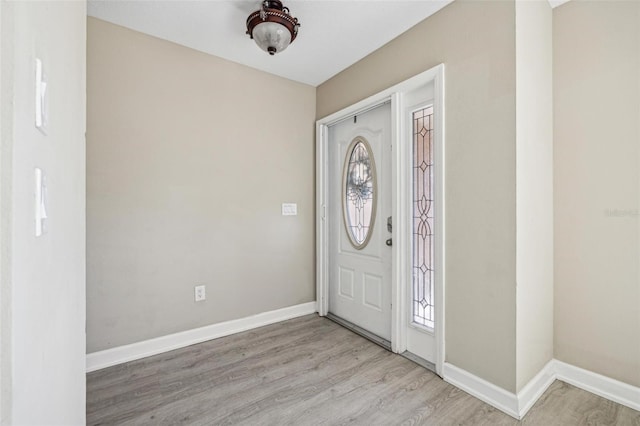 entryway with hardwood / wood-style flooring