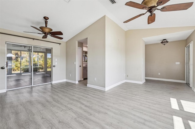 unfurnished room featuring ceiling fan, light hardwood / wood-style flooring, and lofted ceiling