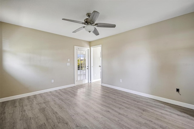 unfurnished room featuring ceiling fan and hardwood / wood-style floors