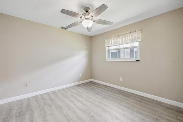 empty room featuring ceiling fan and hardwood / wood-style flooring