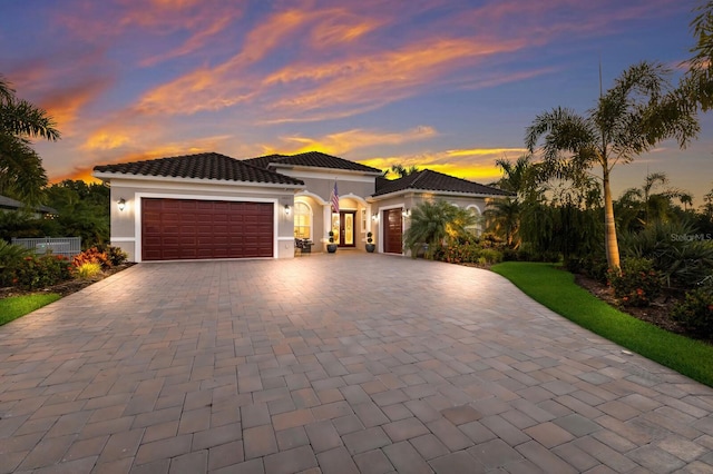 mediterranean / spanish-style house featuring a garage