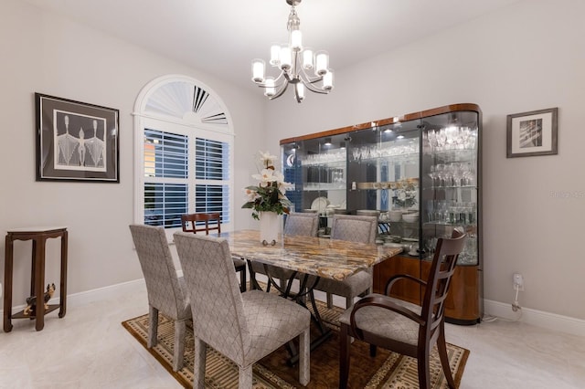 dining area with a notable chandelier