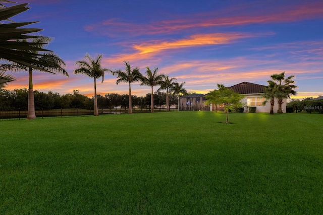 view of yard at dusk