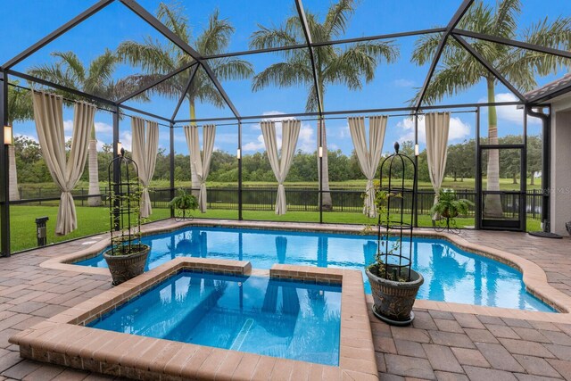 view of swimming pool featuring a lanai, a water view, an in ground hot tub, and a patio area