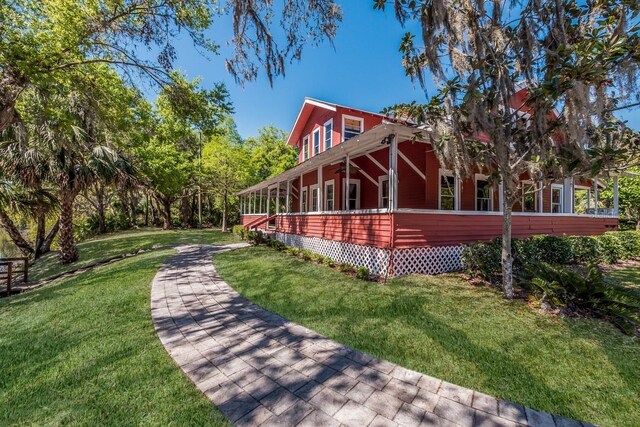 view of property exterior with a lawn