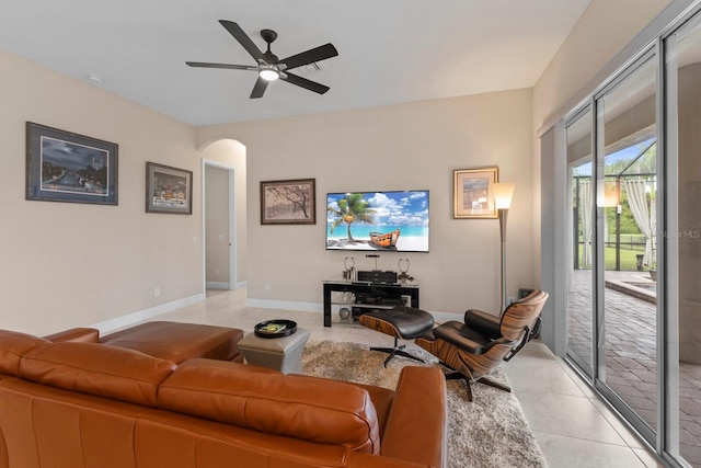 living room with ceiling fan and light tile patterned floors