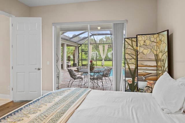 bedroom featuring access to outside and wood-type flooring