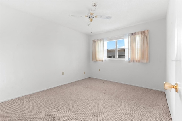 unfurnished room featuring ceiling fan, carpet floors, and baseboards