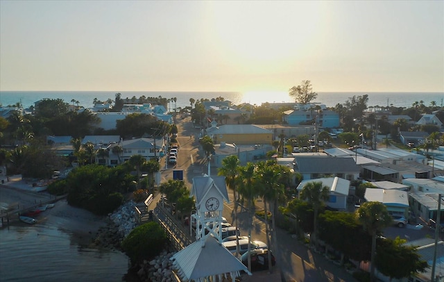 aerial view at dusk with a water view