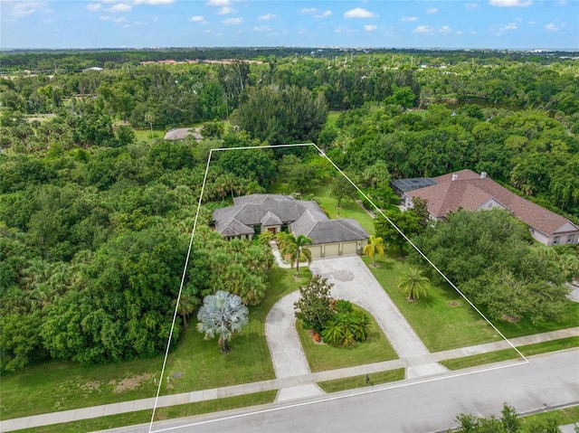 drone / aerial view with a view of trees