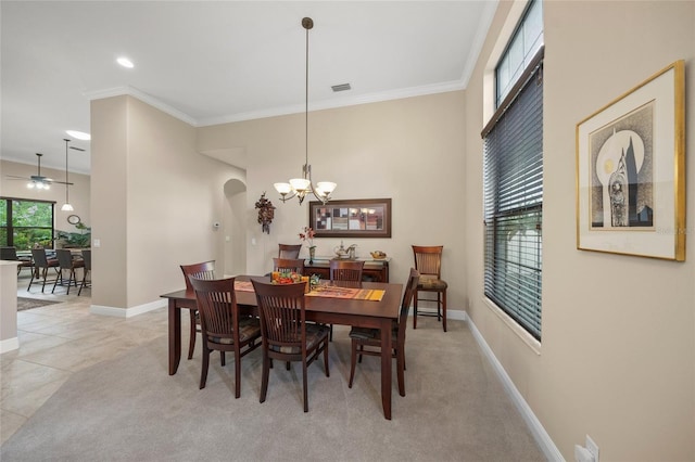 dining room with a notable chandelier, visible vents, baseboards, and ornamental molding