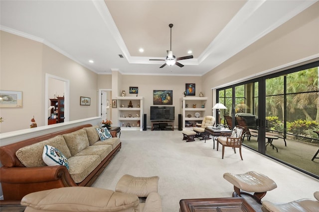 living room featuring recessed lighting, ceiling fan, crown molding, a raised ceiling, and carpet flooring