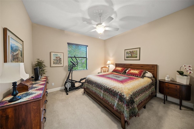 bedroom with baseboards, light carpet, and ceiling fan