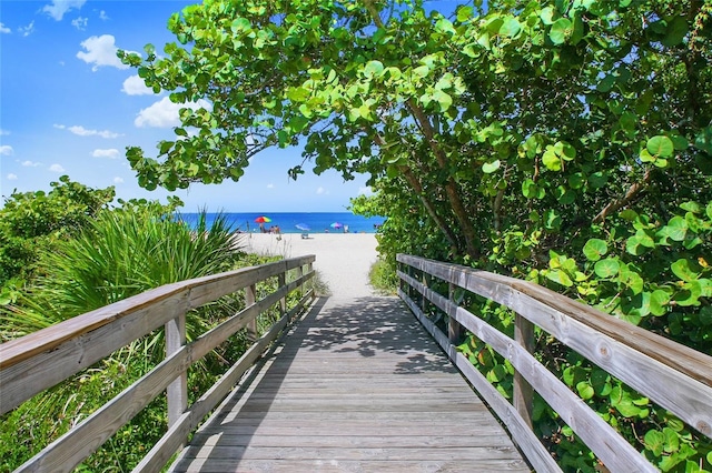 view of property's community with a view of the beach and a water view