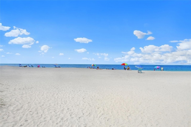 view of water feature with a beach view