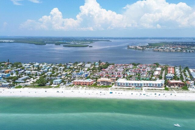 birds eye view of property with a view of the beach and a water view