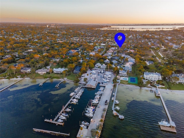 aerial view at dusk with a water view