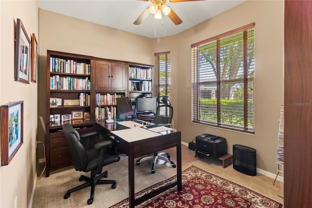 office featuring light colored carpet and ceiling fan