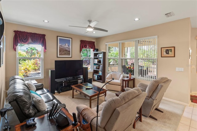 tiled living room featuring ceiling fan