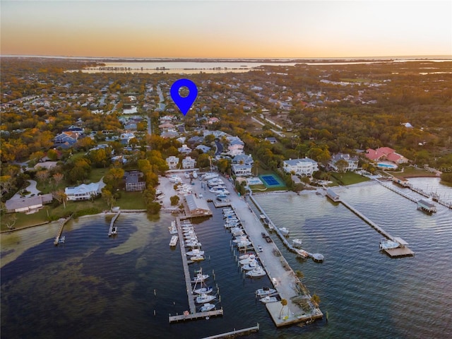 aerial view at dusk with a water view