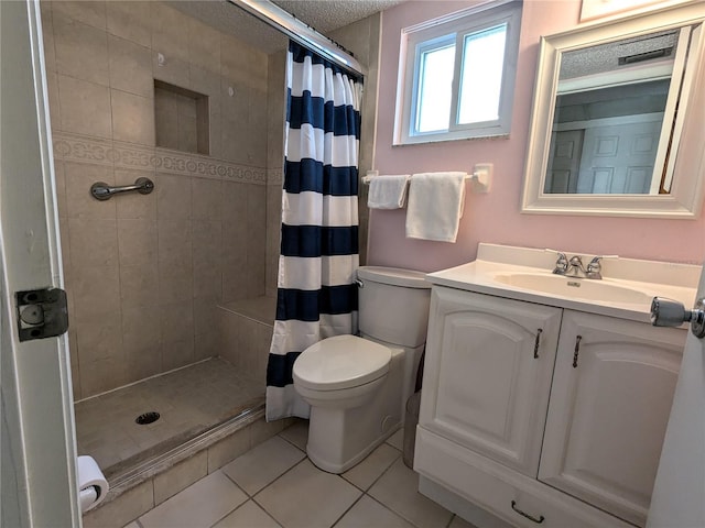 bathroom featuring a shower stall, toilet, and tile patterned floors