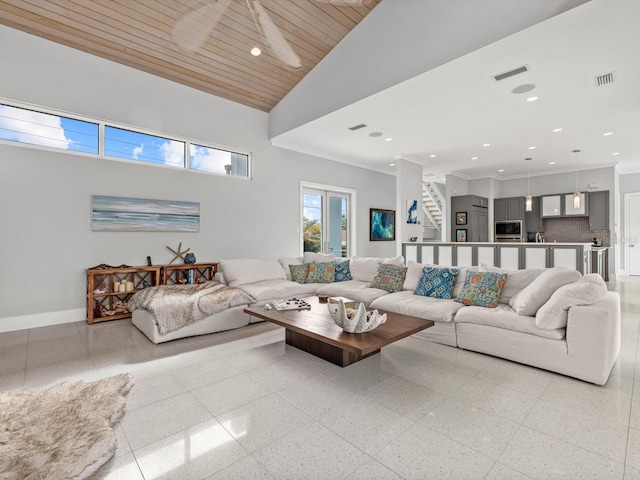 living area with light speckled floor, wooden ceiling, recessed lighting, visible vents, and baseboards